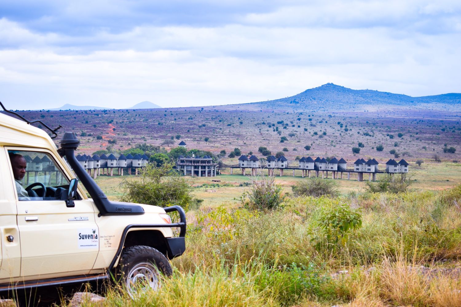 Suvenia Safaris guide leading travelers on an East Africa safari